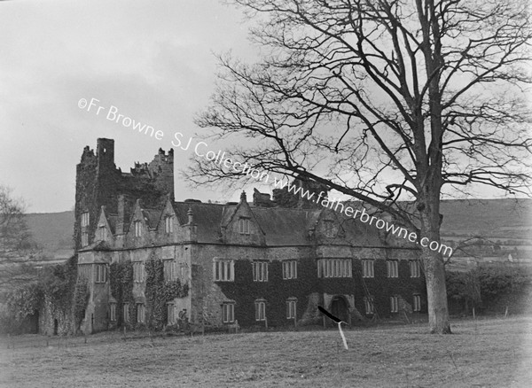 CARRICK CASTLE WHERE DERMOD O'HURLEY WAS CAPTURED 1592 FROM N.W. FROM GARDEN